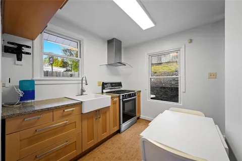 a kitchen with a stove and a sink