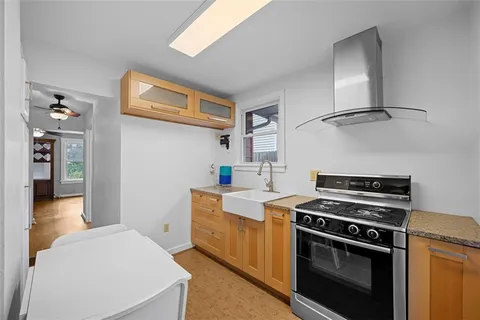 a kitchen with a stove and a sink