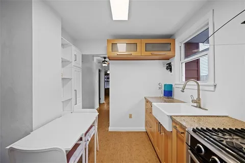 a kitchen that has a sink and a stove