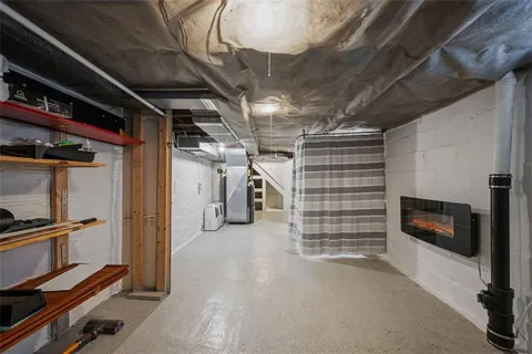 a view of an empty room with a fireplace