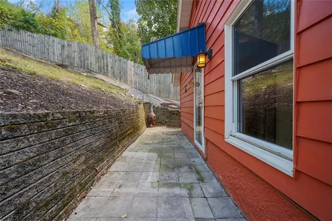 a view of small yard with wooden fence