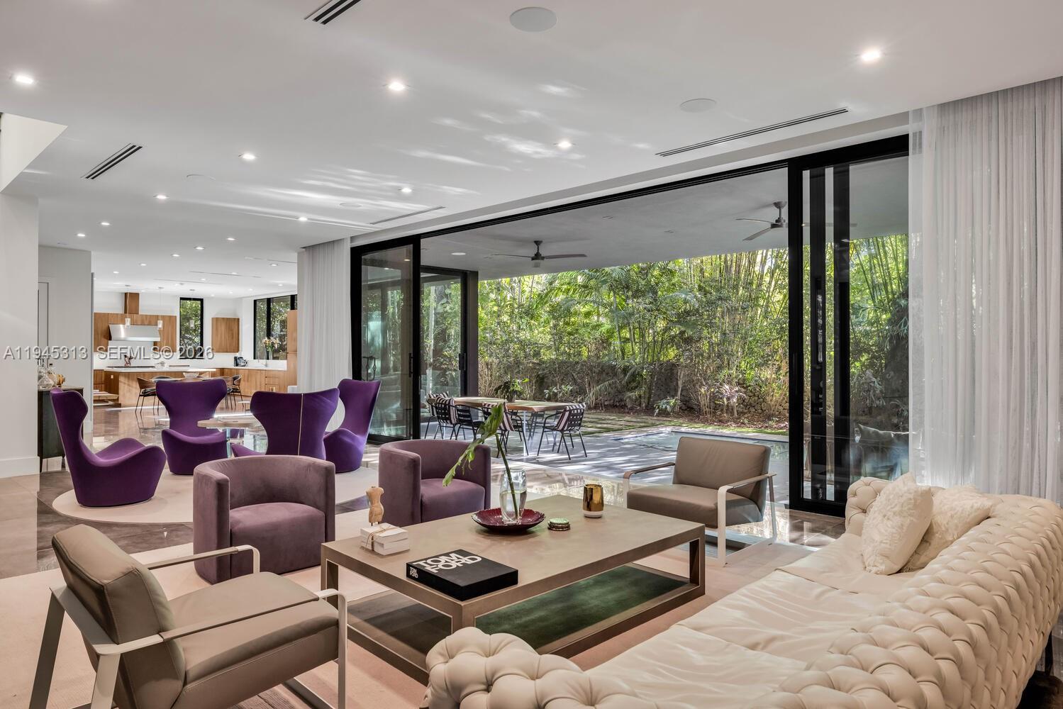 3232 Emathla Street Miami, FL 33133 - Photo 14 of 38 a living room with furniture and a large window