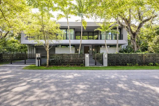 a view of a house with a yard and plants