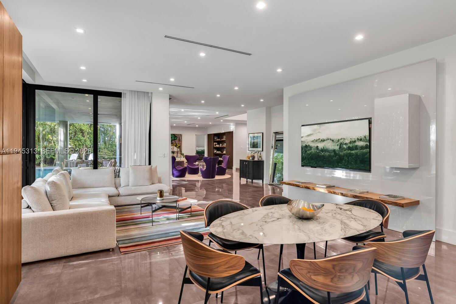 3232 Emathla Street Miami, FL 33133 - Photo 24 of 38 a living room with furniture and a large window