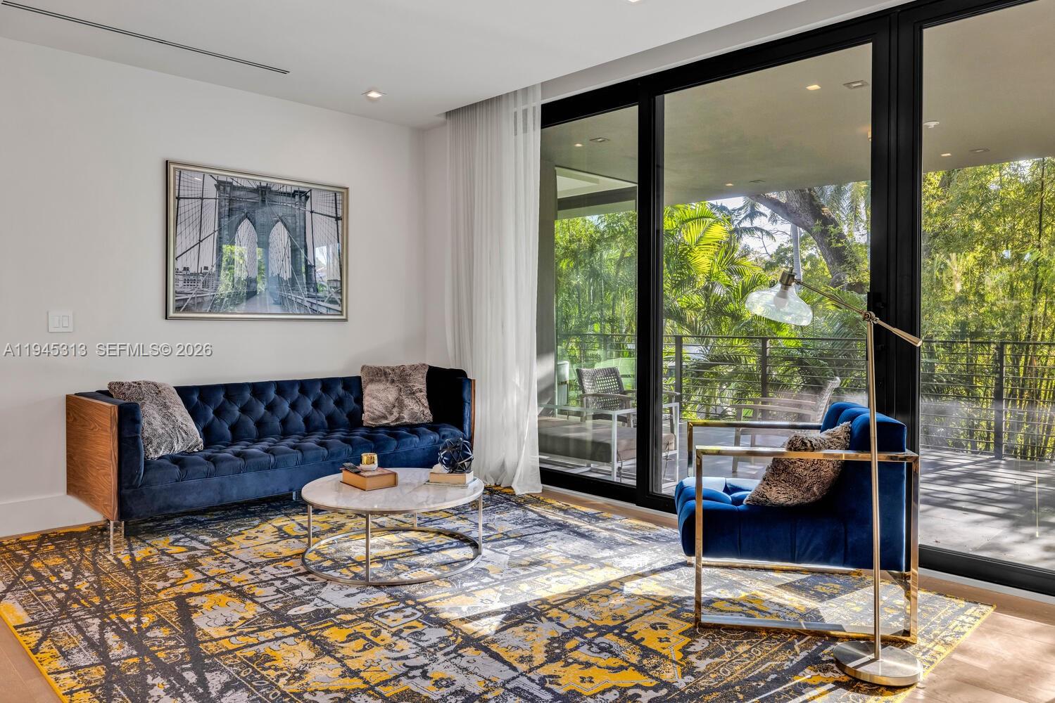 3232 Emathla Street Miami, FL 33133 - Photo 26 of 38 a living room with furniture and a large window