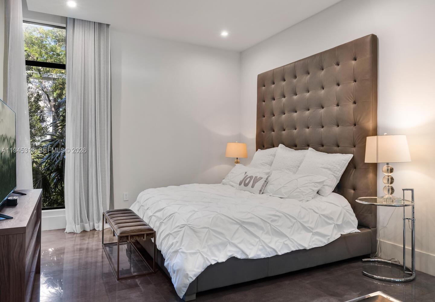 3232 Emathla Street Miami, FL 33133 - Photo 32 of 38 a bedroom with a bed and a window