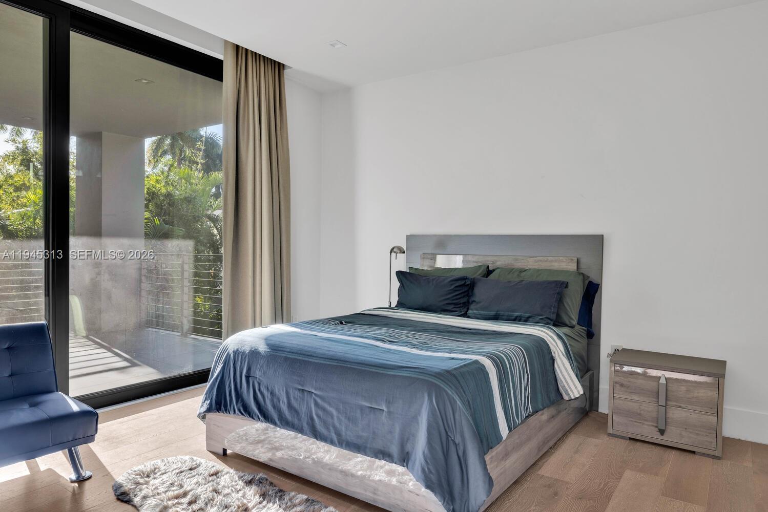 3232 Emathla Street Miami, FL 33133 - Photo 33 of 38 a bedroom with a large bed and a window