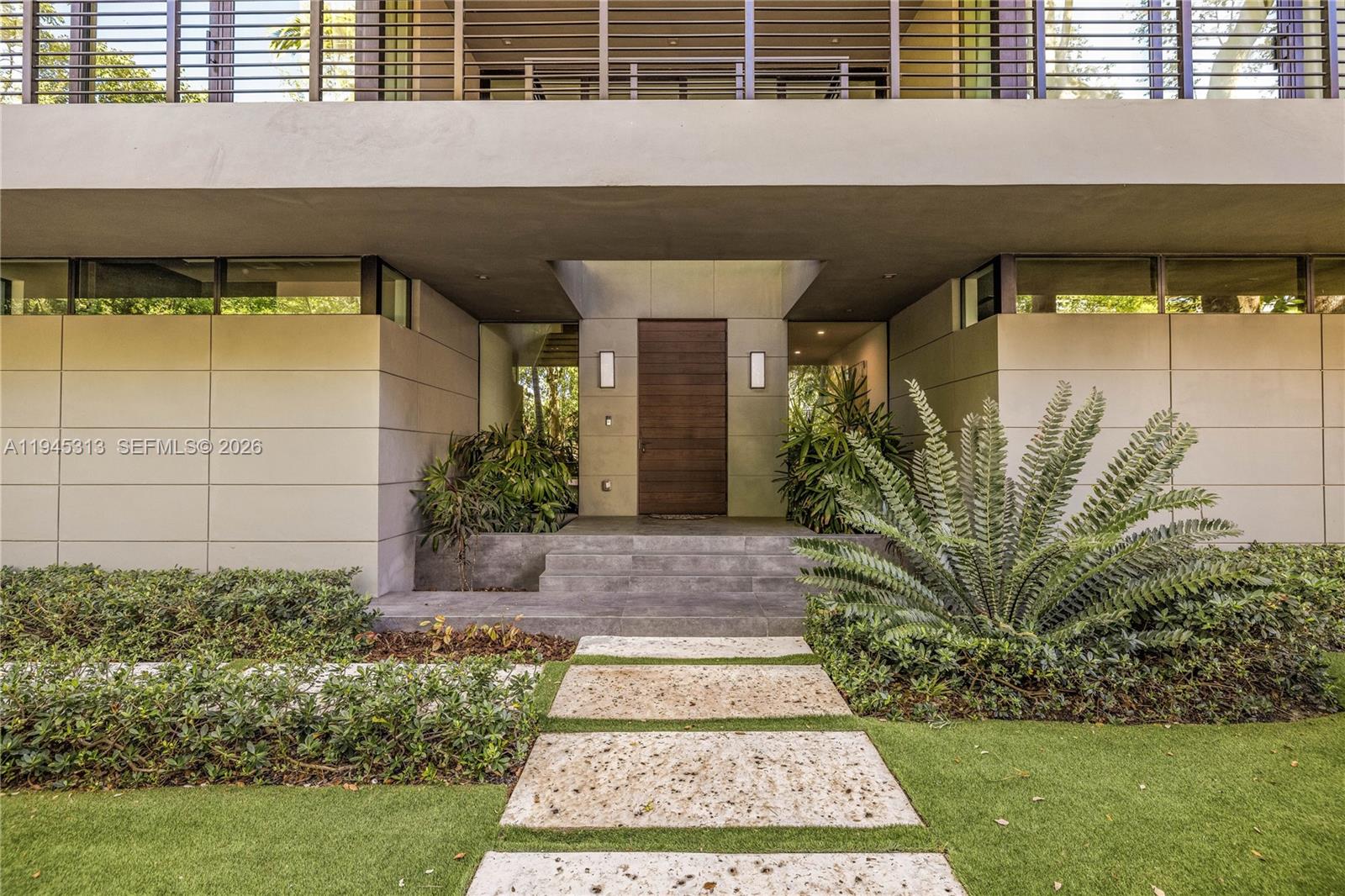 3232 Emathla Street Miami, FL 33133 - Photo 6 of 38 a front view of a house with garden