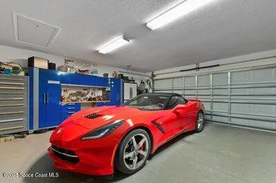a view of a livingroom with furniture and a potted plant