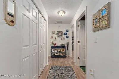 a large kitchen with a table and chairs