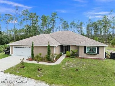 a bedroom with a bed and a table