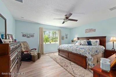 a spacious bathroom with a double vanity sink a mirror and a bathtub