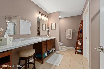 a view of walk in closet with clothes