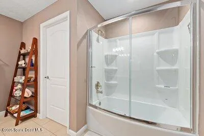 a cabinet with granite countertop lots of different kinds of food