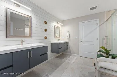 a view of a patio with table and chairs potted plants with wooden floor