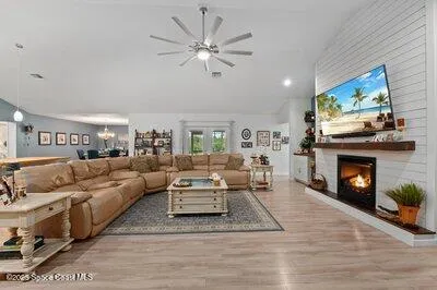 a large kitchen with lots of counter space and painting on the wall