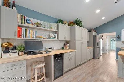 a bedroom with furniture and a window