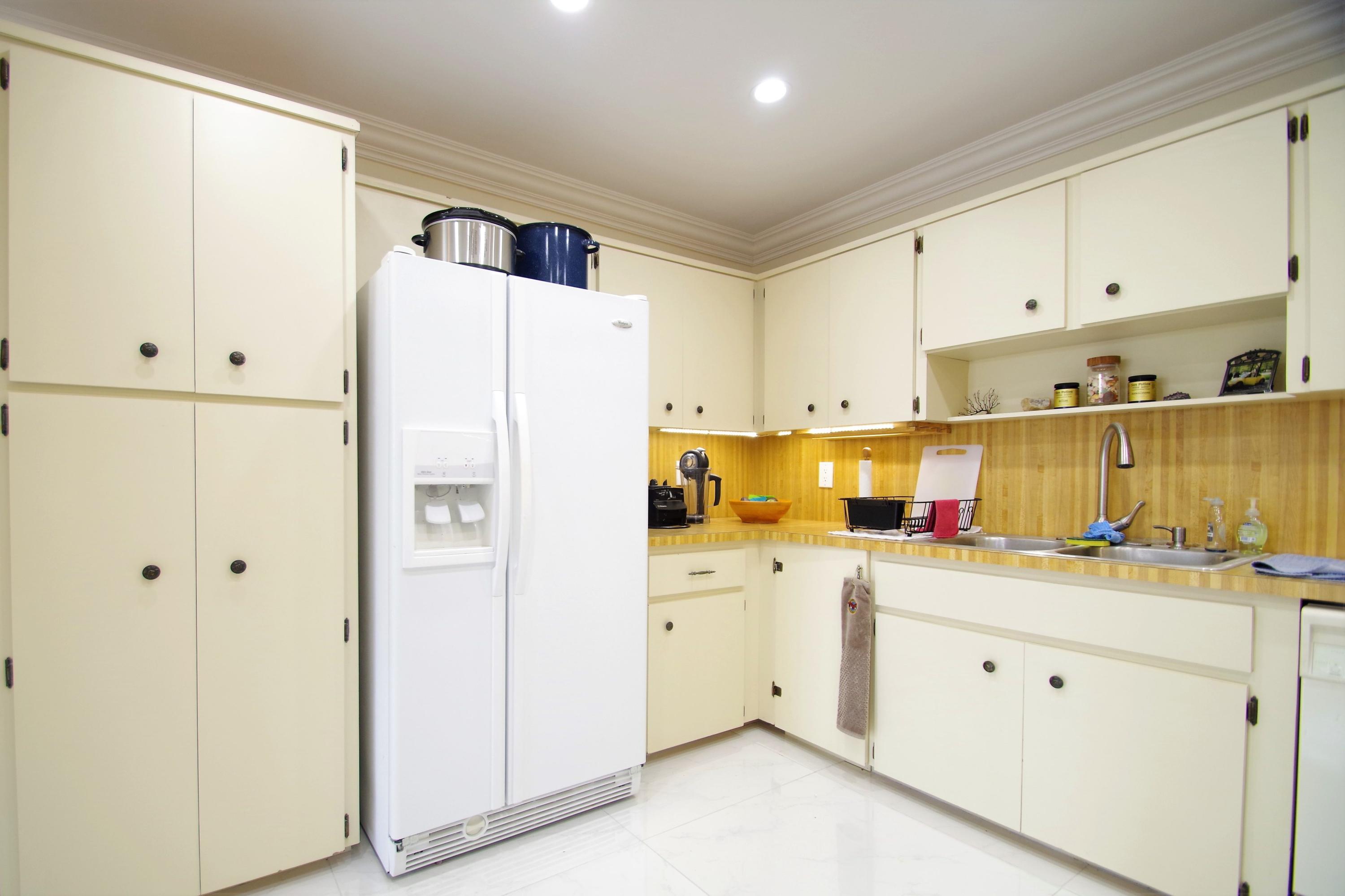 201 Southwest 1st Street, Unit 150 Boca Raton, FL 33432 - Photo 7 of 20 a white refrigerator freezer sitting inside of a kitchen