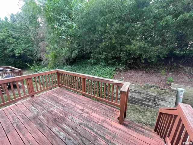 a view of deck with wooden floor and outdoor seating