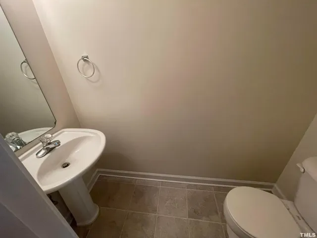 a bathroom with a sink and toilet