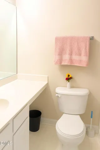 a bathroom with a toilet and a sink