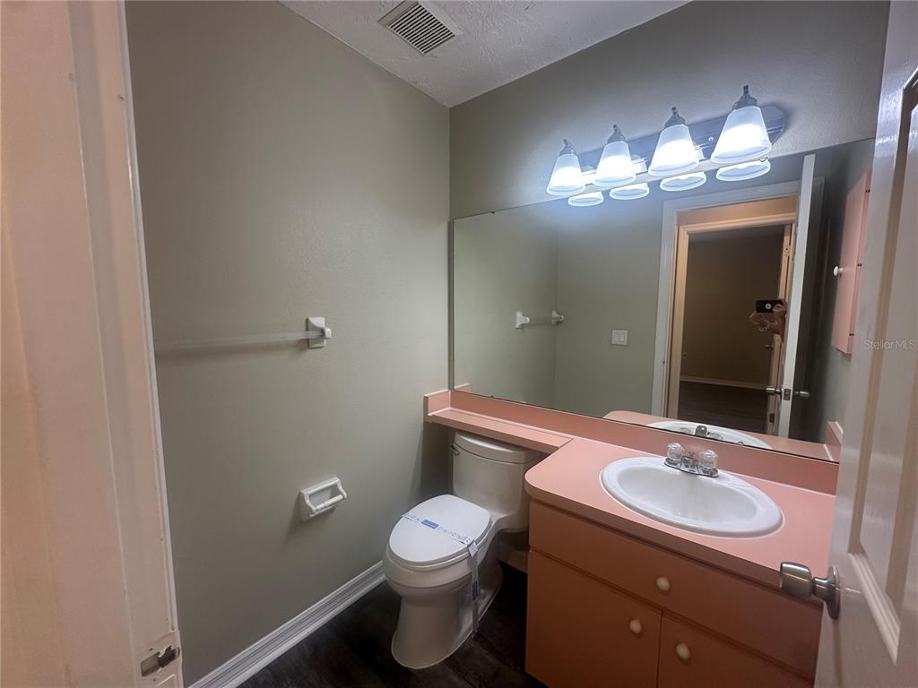 4495 Diamond Circle East Sarasota, FL 34233 - Photo 16 of 21 a bathroom with a sink and a mirror