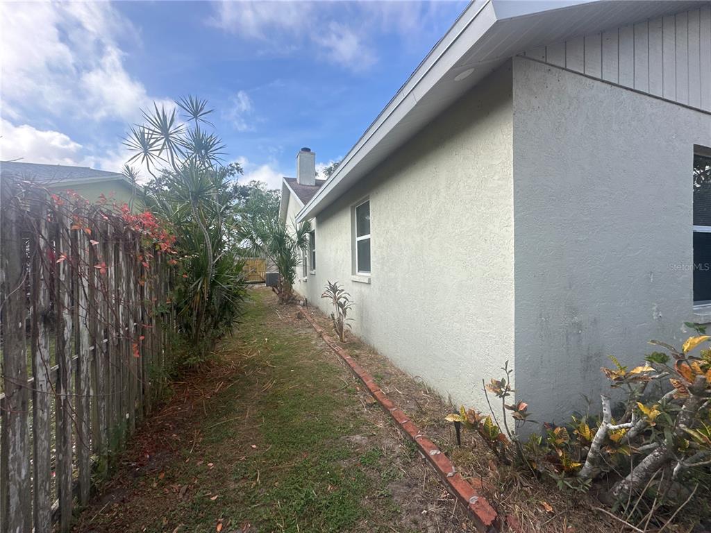 4495 Diamond Circle East Sarasota, FL 34233 - Photo 18 of 21 a pathway of a house with a yard