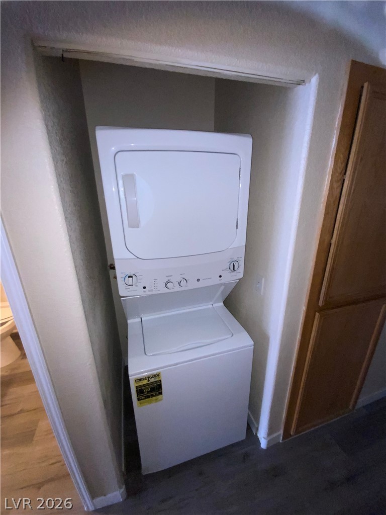 4730 East Craig Road, Unit 1154 Las Vegas, NV 89115 - Photo 8 of 13 A compact laundry nook offers convenient stacked appliances.