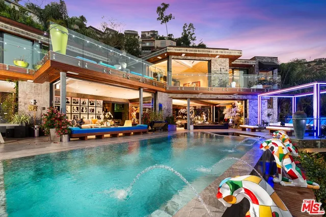 a view of swimming pool with outdoor seating