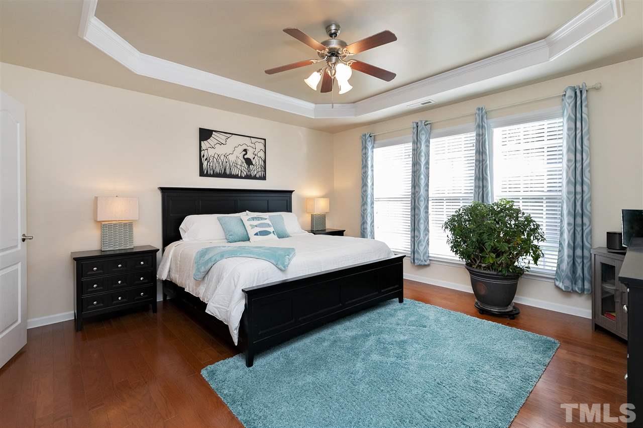 5110 Kate Denson Way Raleigh, NC 27612 - Photo 13 of 30 a spacious bedroom with a bed and window
