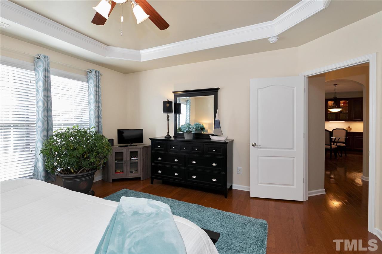 5110 Kate Denson Way Raleigh, NC 27612 - Photo 14 of 30 a bedroom with a bed and a dresser