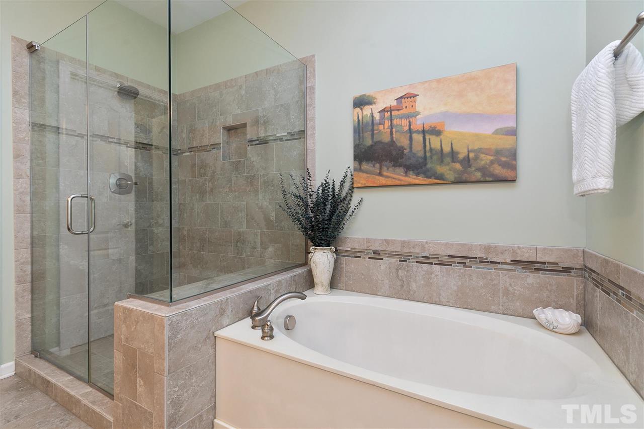5110 Kate Denson Way Raleigh, NC 27612 - Photo 16 of 30 a bathroom with a bathtub and a shower