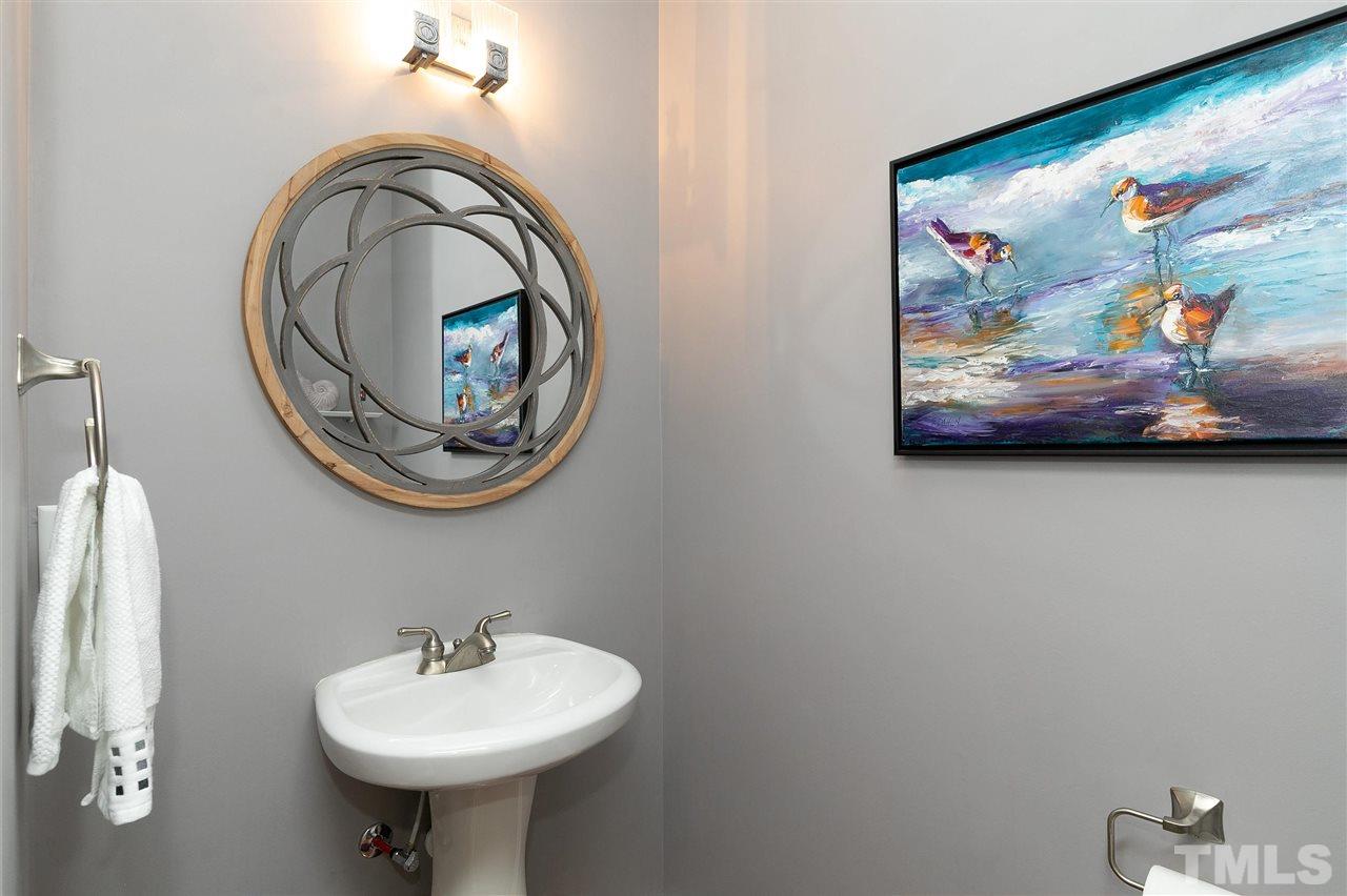 5110 Kate Denson Way Raleigh, NC 27612 - Photo 18 of 30 a bathroom with a sink and a mirror
