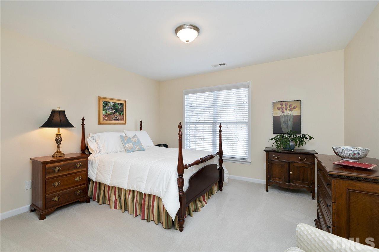 5110 Kate Denson Way Raleigh, NC 27612 - Photo 21 of 30 a bedroom with a bed and dresser