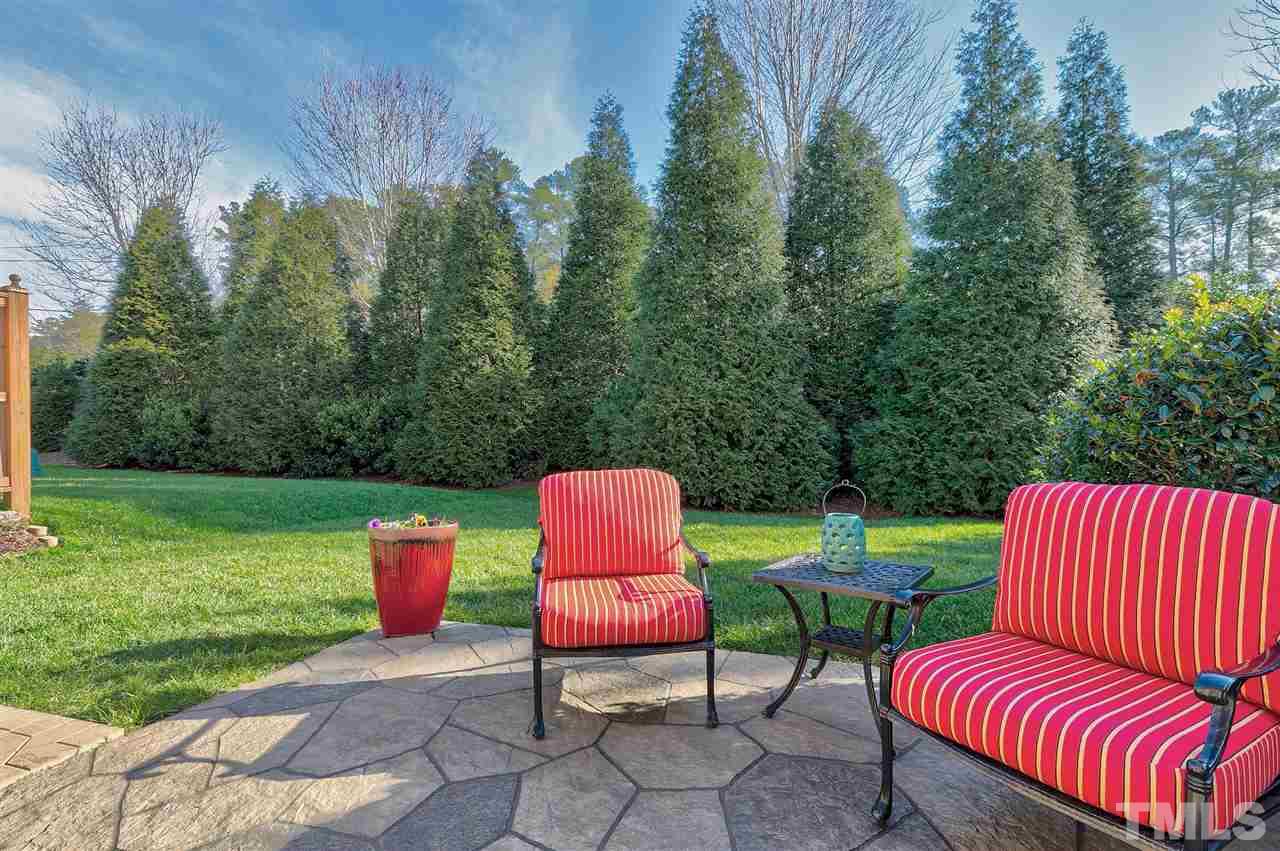 5110 Kate Denson Way Raleigh, NC 27612 - Photo 27 of 30 a backyard of a house with outdoor seating