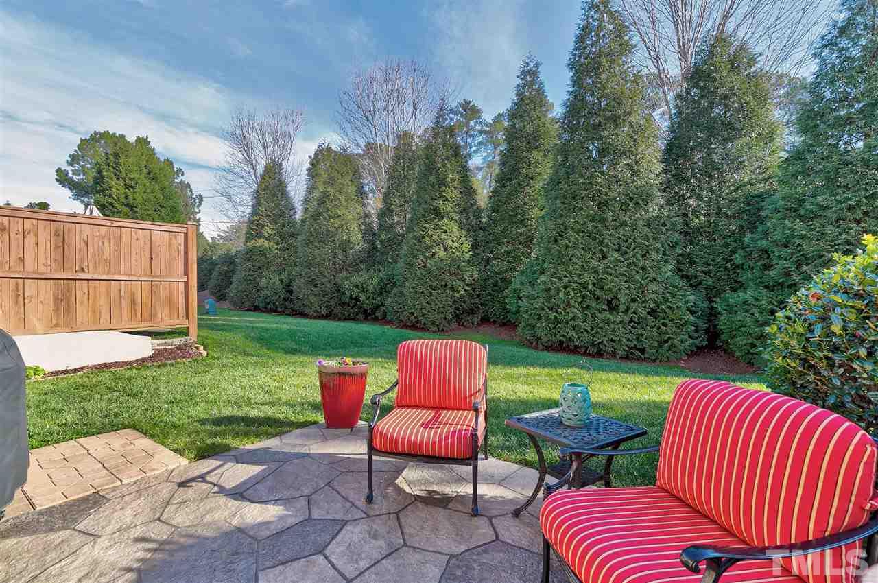 5110 Kate Denson Way Raleigh, NC 27612 - Photo 28 of 30 a couple of chairs sitting in backyard with small cabin