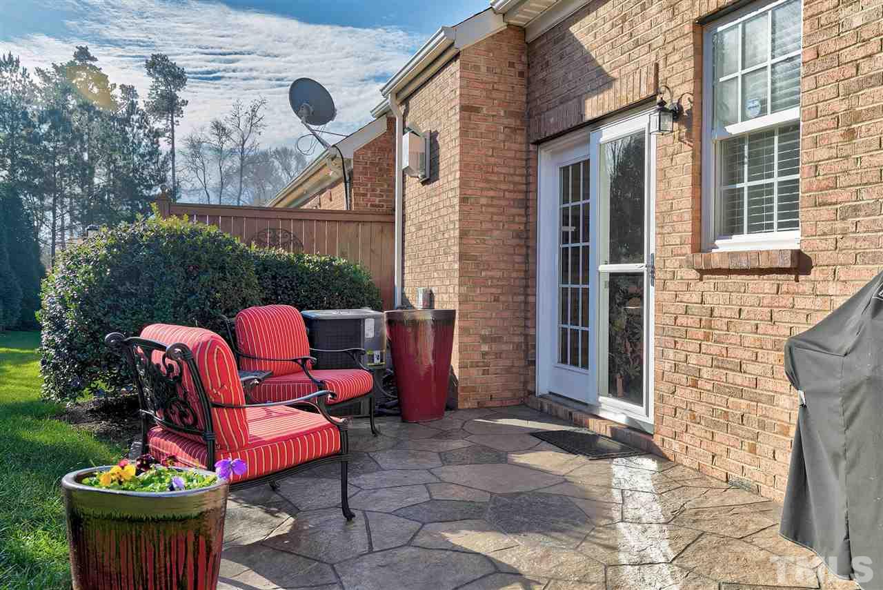 5110 Kate Denson Way Raleigh, NC 27612 - Photo 29 of 30 a backyard of a house with outdoor seating
