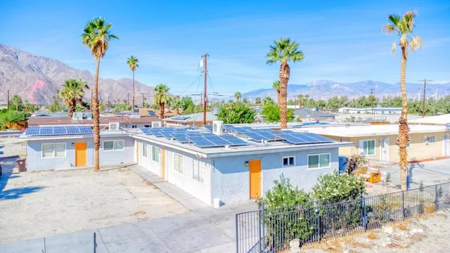 an empty room with wooden floor and a window