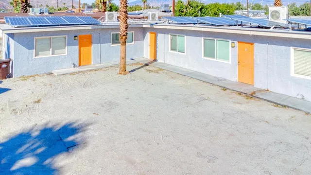 a view of residential houses with outdoor space