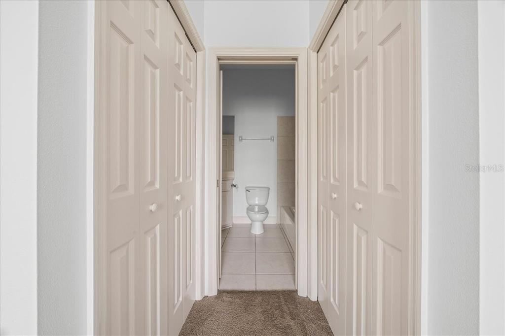 3003 Southwest 41st Place Ocala, FL 34474 - Photo 11 of 65 a view of a bathroom from the hallway