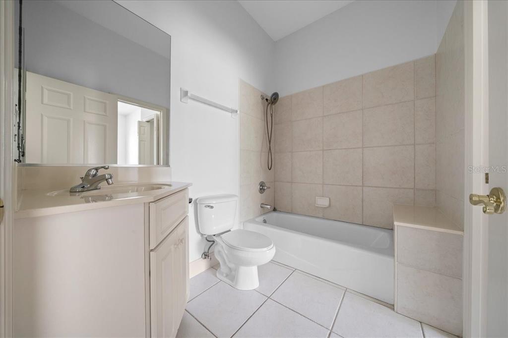 3003 Southwest 41st Place Ocala, FL 34474 - Photo 13 of 65 a bathroom with a sink a toilet and shower