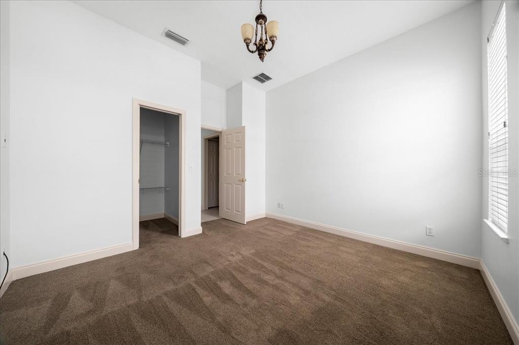 3003 Southwest 41st Place Ocala, FL 34474 - Photo 15 of 65 a view of empty room with ceiling fan