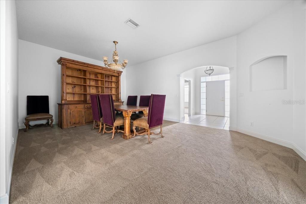 3003 Southwest 41st Place Ocala, FL 34474 - Photo 21 of 65 a view of a livingroom with furniture and a ceiling fan
