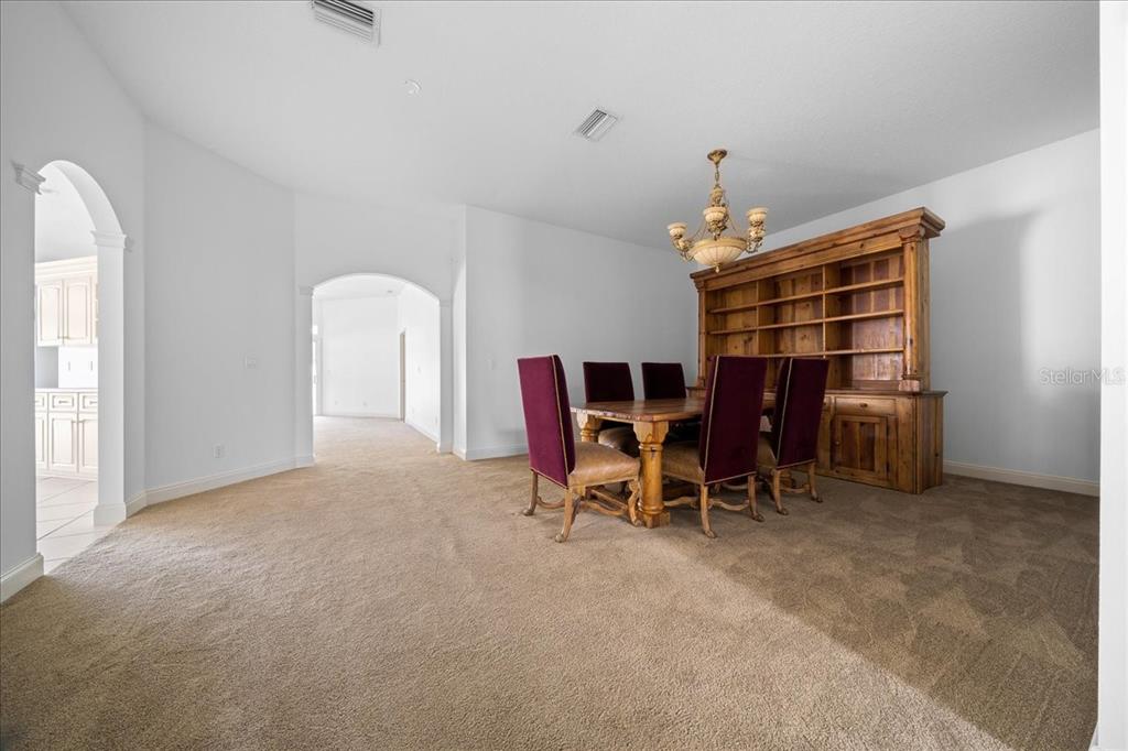 3003 Southwest 41st Place Ocala, FL 34474 - Photo 22 of 65 a view of a livingroom with furniture and chandelier