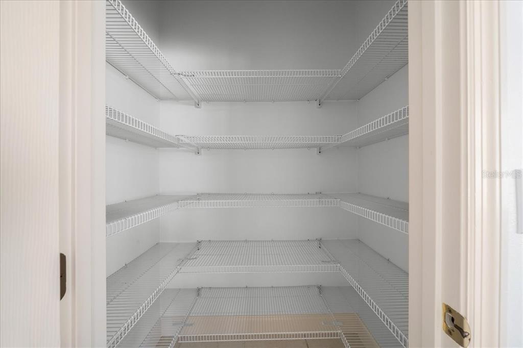 3003 Southwest 41st Place Ocala, FL 34474 - Photo 32 of 65 a view of walk in closet with empty racks