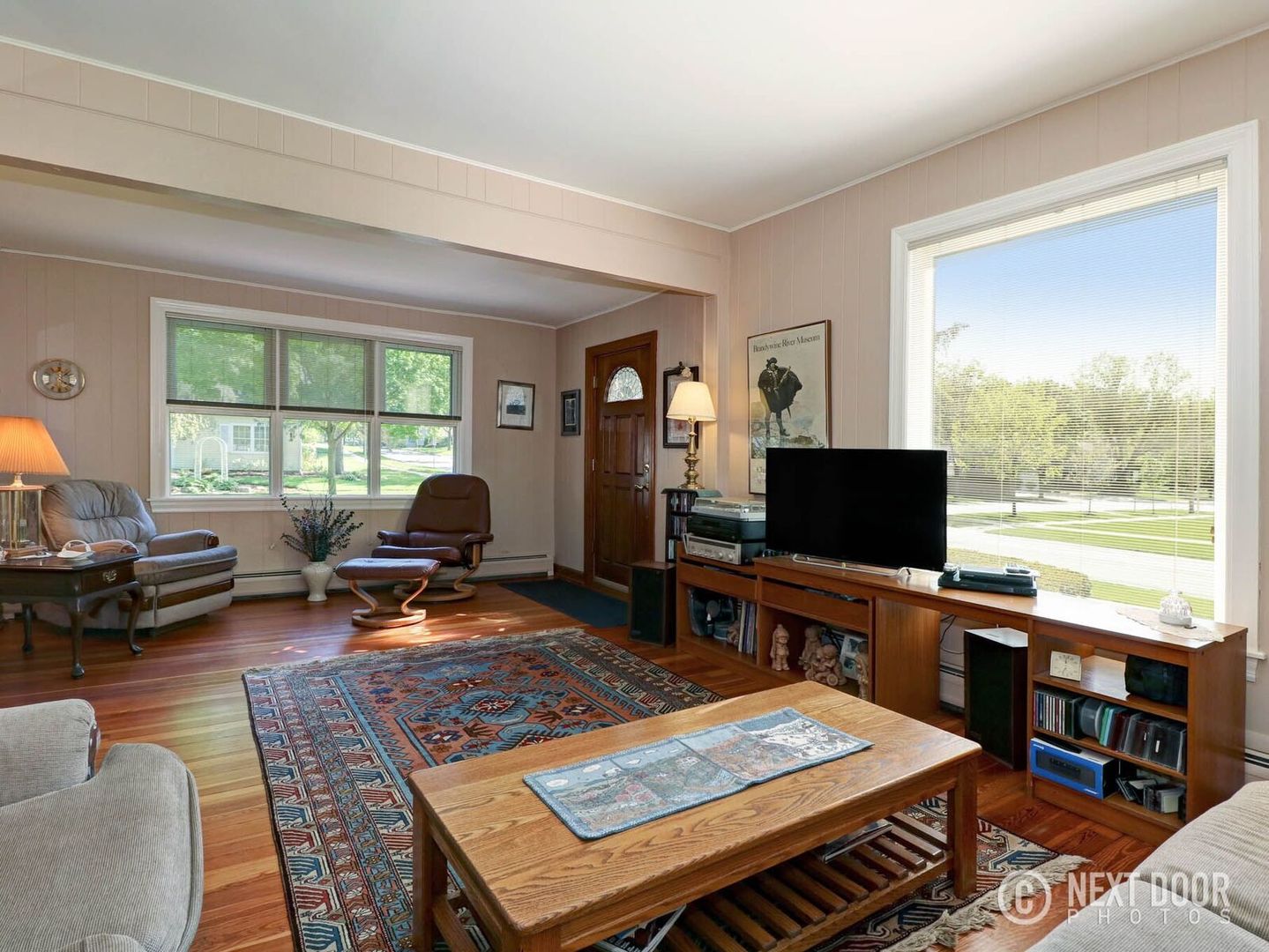 125 South Maple Street Itasca, IL 60143 - Photo 12 of 24 a living room with furniture a flat screen tv and a large window
