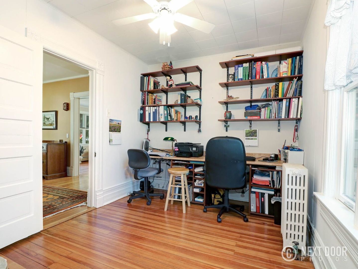 125 South Maple Street Itasca, IL 60143 - Photo 13 of 24 a view of a workspace with furniture and wooden floor