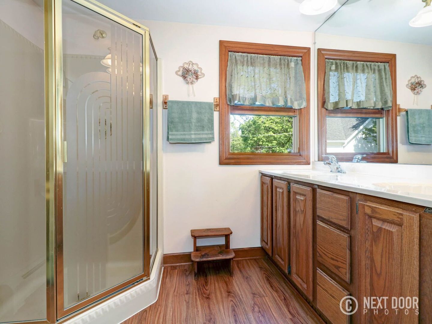 125 South Maple Street Itasca, IL 60143 - Photo 14 of 24 a bathroom with a sink and a large mirror