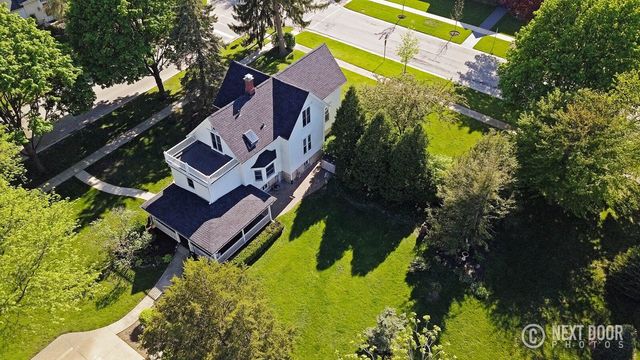 125 South Maple Street Itasca, IL 60143 - Photo 4 of 24 an aerial view of a house with a yard