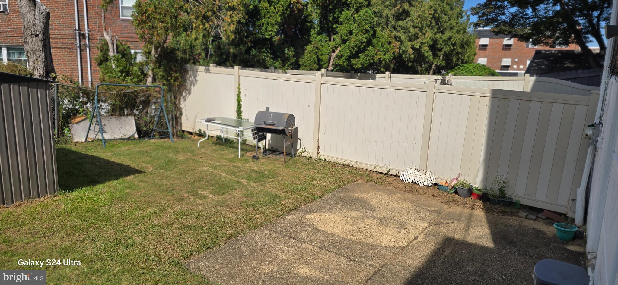 2806 Walnut Hill Street Philadelphia, PA 19152 - Photo 23 of 34 a view of a backyard with wooden fence